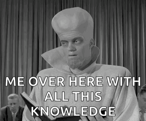 A Man Holding A Book With The Words Me Over Here With All This Knowledge GIF