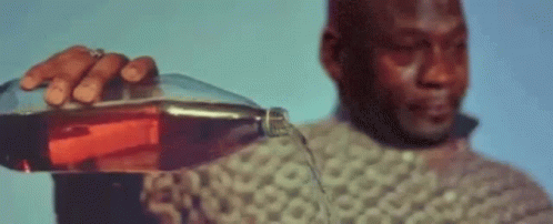 A Man Holding A Bottle Of Alcohol With A Bitcoin Symbol In The Background GIF