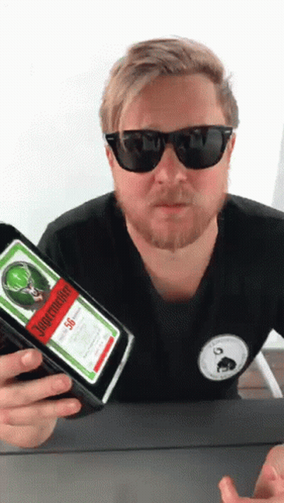 A Man Holding A Bottle Of Jagermeister 50 GIF
