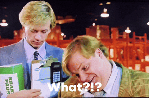 A Man Holding A Box Of Brake Pads And Another Man Holding A Cell Phone Says " What " GIF