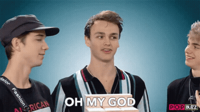A Man Holding A Box That Says Oh My God On It GIF