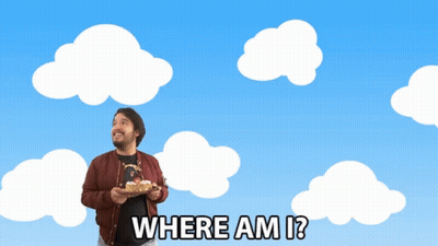 A Man Holding A Cake With The Words Where Am I GIF