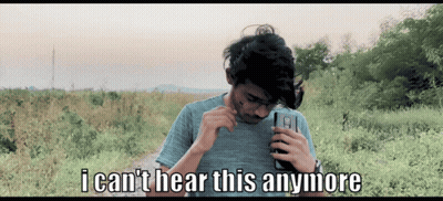 A Man Holding A Cell Phone With The Words " I Can 'T Hear This Anymore " On The Bottom GIF