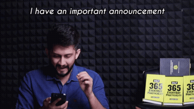 A Man Holding A Cell Phone With The Words I Have An Important Announcement Behind Him GIF