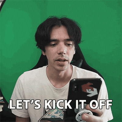 A Man Holding A Cell Phone With The Words Let 'S Kick It Off GIF