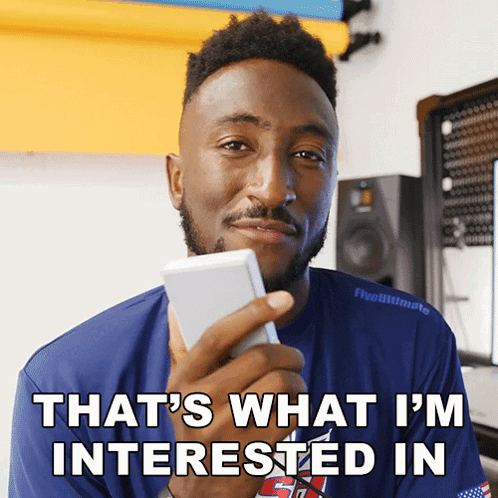 A Man Holding A Cell Phone With The Words That 'S What I 'M Interested In GIF