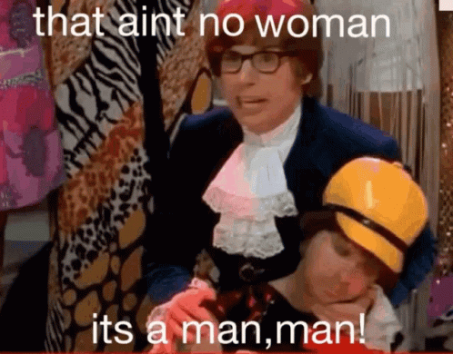 A Man Holding A Child With The Words That Ain 'T No Woman Its A Man Man GIF