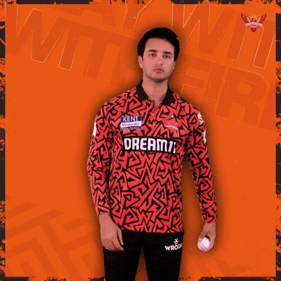A Man Holding A Cricket Ball In A Jersey That Says Kent GIF
