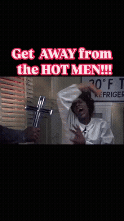 A Man Holding A Cross With The Words Get Away From The Hot Men GIF