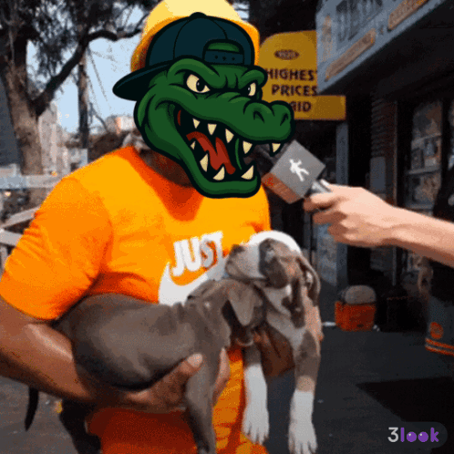 A Man Holding A Dog With A Crocodile Mask On His Head GIF