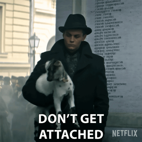 A Man Holding A Dog With The Words " Don 'T Get Attached " On The Bottom GIF