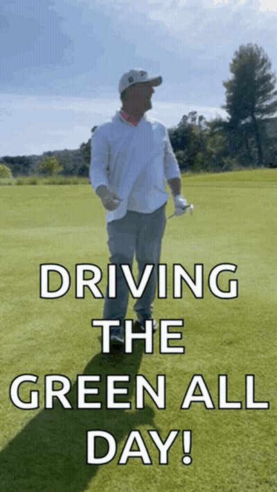 a man holding a golf club on a golf course with the words driving the green all day below him