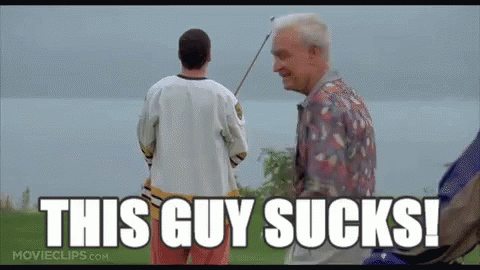 A Man Holding A Golf Club Standing Next To Another Man With The Words `` This Guy Sucks ! '' GIF