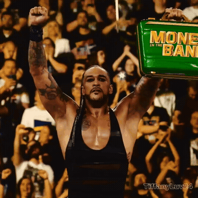 A Man Holding A Green Money In The Bank GIF