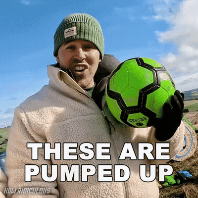 A Man Holding A Green Soccer Ball With The Words " These Are Pumped Up " Above Him GIF