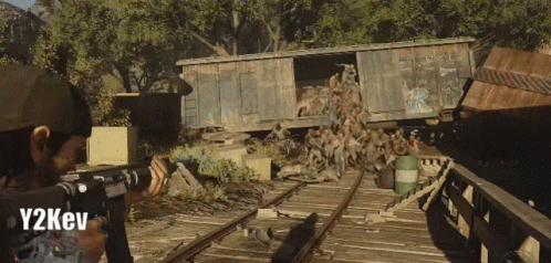 A Man Holding A Gun In A Video Game With Y2kev Below Him GIF