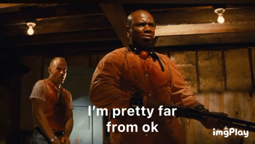 A Man Holding A Gun With The Words I 'M Pretty Far From Ok Below Him GIF