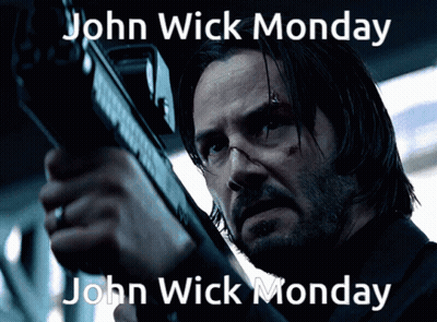 A Man Holding A Gun With The Words John Wick Monday On The Bottom GIF