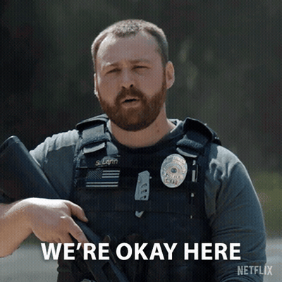 A Man Holding A Gun With The Words We 'Re Okay Here On The Bottom GIF