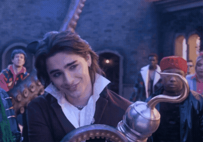 A Man Holding A Hook In Front Of A Crowd GIF