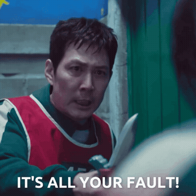 A Man Holding A Knife With The Words " It 'S All Your Fault " Below Him GIF