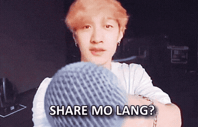 a man holding a knitted hat with the words share mo lang written above him