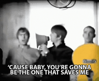 A Man Holding A Megaphone With The Words " Cause Baby You 'Re Gonna Be The One That Saves Me " Above Him GIF