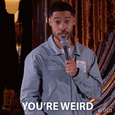 A Man Holding A Microphone And Saying You 'Re Weird On Netflix GIF