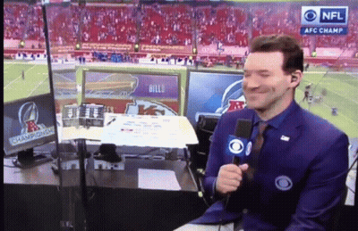 A Man Holding A Microphone In Front Of A Screen That Says Nfl Afc Champions GIF