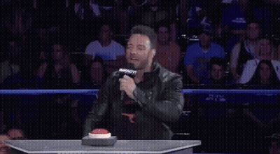 A Man Holding A Microphone With A Speech Bubble That Says " Dummy " GIF