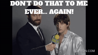A Man Holding A Microphone With The Words " Don T Do That To Me Ever Again " On The Top GIF