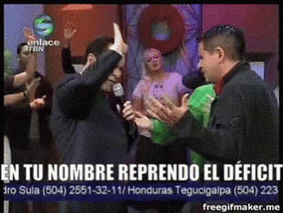 A Man Holding A Microphone With The Words En Tu Nombre Reprendo El Deficit In The Corner GIF