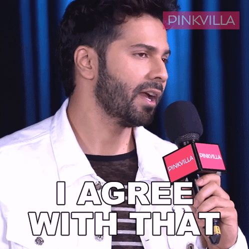 A Man Holding A Microphone With The Words I Agree With That On It GIF