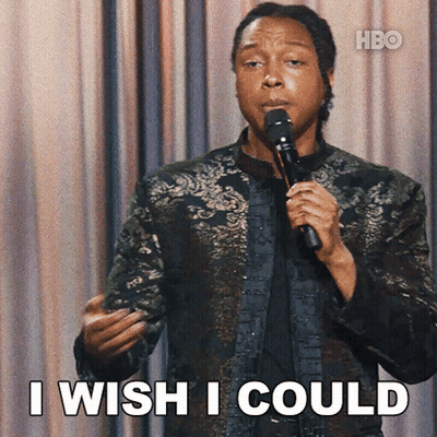 A Man Holding A Microphone With The Words I Wish I Could Below Him GIF