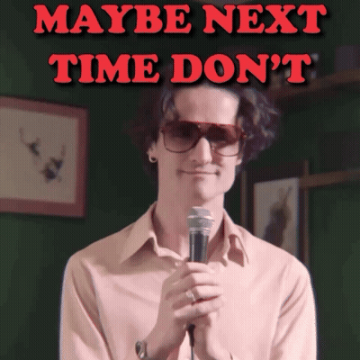 A Man Holding A Microphone With The Words Maybe Next Time Do N't Behind Him GIF