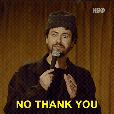 A Man Holding A Microphone With The Words No Thank You Behind Him GIF