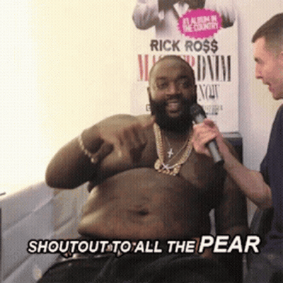 A Man Holding A Microphone With The Words Shoutout To All The Pear Written Below Him GIF