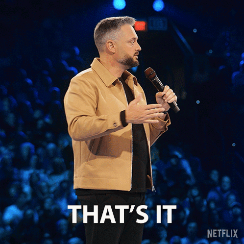 A Man Holding A Microphone With The Words That 'S It Written Below Him GIF