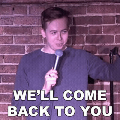 A Man Holding A Microphone With The Words We 'Ll Come Back To You Behind Him GIF