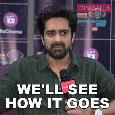 A Man Holding A Microphone With The Words We 'Ll See How It Goes GIF