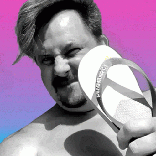 A Man Holding A Pair Of Havaianas Flip Flops GIF