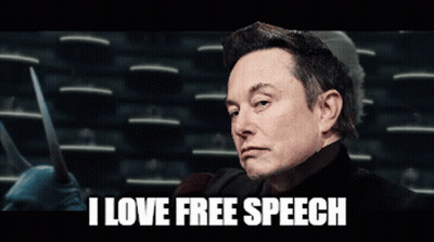 A Man Holding A Pair Of Scissors With The Words I Love Free Speech Behind Him GIF