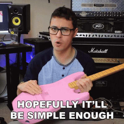 A Man Holding A Pink Guitar In Front Of A Marshall Amp GIF