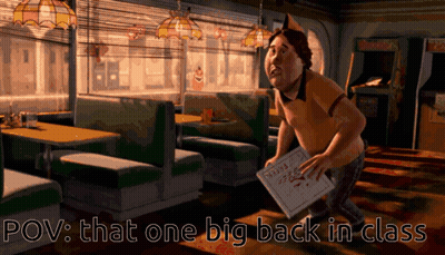 A Man Holding A Pizza Box In A Diner With The Words Pov That One Big Back In Class Below Him GIF