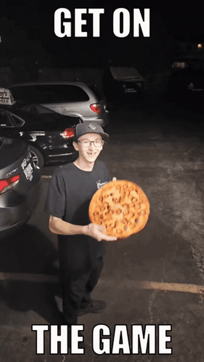 A Man Holding A Pizza With The Words Get On The Game Written Below Him GIF