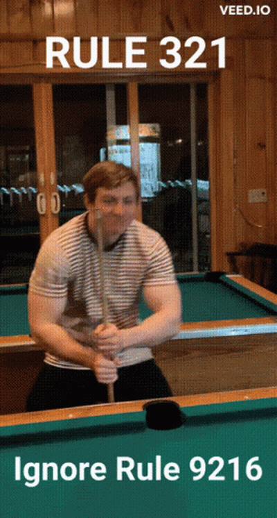 A Man Holding A Pool Cue In Front Of A Pool Table With The Words Rule 321 Ignore Rule 9216 Below Him GIF