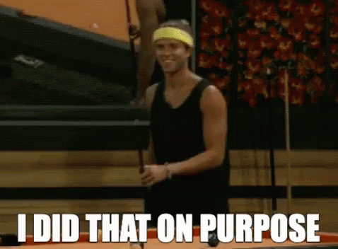 A Man Holding A Pool Cue With The Words I Did That On Purpose Behind Him GIF
