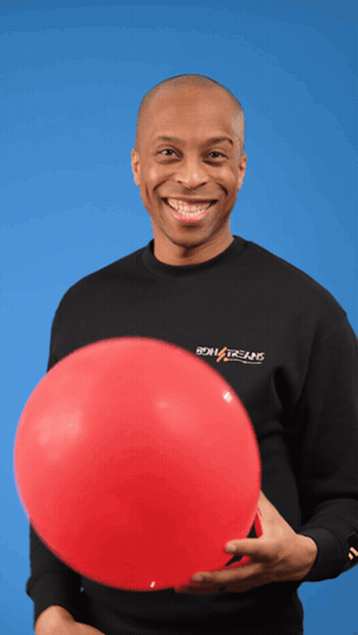A Man Holding A Red Balloon Wearing A Black Shirt That Says Boiling Brains GIF