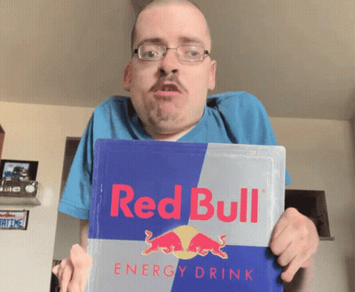 A Man Holding A Red Bull Energy Drink GIF