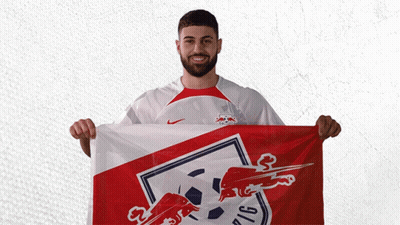 A Man Holding A Red White And Blue Flag With A Bull On It GIF
